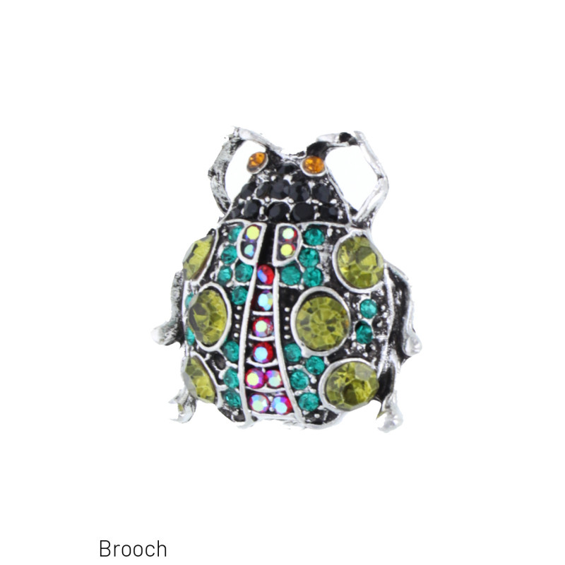 BROCHE CON MARIQUITA Y ESTRÛS