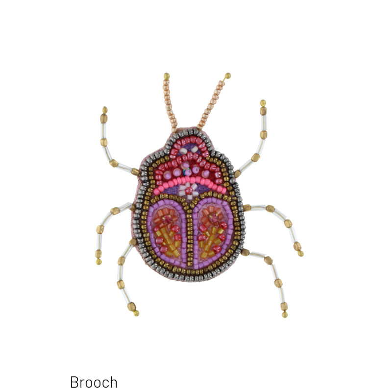 BROCHE MET DIEREN VORM EN KRALEN