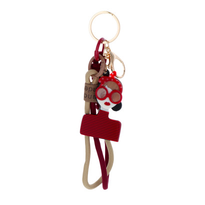 PORTE-CLEFS AVEC DAME, NOEUD PAPILLON ET STRASS